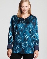 Splashed with a blurred abstract print, this Tahari Woman Plus blouse takes your 9-to-5 look to dramatic style depths. Splashed with a blurred abstract print, this Tahari Woman Plus blouse takes your 9-to-5 look to dramatic style depths.