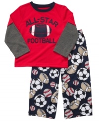 Sports star. He can dream of the big game with this sleepwear set from Carter's, with a layered tee and cozy pajama pants. Sports star. He can dream of the big game with this sleepwear set from Carter's, with a layered tee and cozy pajama pants.