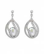 Polish your look with subtle refinement. Crystal Moonlight is encapsulated by intricate strands of clear Swarovski crystal pavé. This exquisite pair of silver tone mixed metal pierced earrings adds glamour to every look. Approximate drop: 1-3/8 inches.