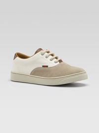 A handsome cross between an oxford and a sneaker, your young man can wear this as both with its combination of sporty cotton and rich suede.Cotton and suede upperFour-grommet lace-up frontStriped webbed tab accentSmooth leather trimRubber soleMade in Italy A handsome cross between an oxford and a sneaker, your young man can wear this as both with its combination of sporty cotton and rich suede.Cotton and suede upperFour-grommet lace-up frontStriped webbed tab accentSmooth leather trimRubber soleMade in Italy