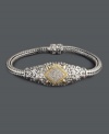 A masterpiece of design -- this ornate bracelet from Balissima by Effy Collection is simply breathtaking. Crafted in scrolling sterling silver and 18k gold, bracelet highlights round-cut diamonds (1/4 ct. t.w.) at center. Approximate length: 7-3/4 inches. Bracelet centerpiece approximate length: 1-3/4. Bracelet centerpiece approximate width: 3/4 inch.