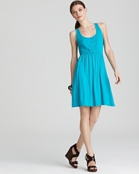 Eyelet cutouts atop this vivid Three Dots dress simply sing summer. Finish with pastel accents for pure feminine charm. Eyelet cutouts atop this vivid Three Dots dress simply sing summer. Finish with pastel accents for pure feminine charm.