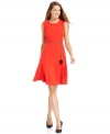 Calvin Klein gives an A-line silhouette modern edge with a tasseled chain belt and bright hue. (Clearance)