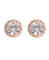 Studs that sparkle in the light. Betsey Johnson earrings feature a round-cut crystal surrounded by a halo of glittering glass stones. Set in antique gold tone mixed metal. Approximate diameter: 1 inch.