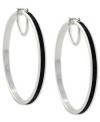 Hit the right notes with these hoop earrings from Jessica Simpson. Crafted from silver tone mixed metal, they also shine with black glitter. Approximate drop: 2-1/2 inches. Approximate diameter: 2-1/2 inches.