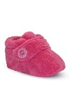 This super cute bootie is crafted in twinface sheepskin, with strap upper and logo button detail.