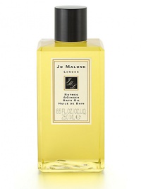 Jo Malone's first fragrance blends sandalwood and cedarwood with nutmeg and ginger for an unexpected, warm, woody scent. Nutmeg & Ginger Bath Oil gently fragrances and moisturzes skin. 8.5 oz. Jo Malone's first fragrance blends sandalwood and cedarwood with nutmeg and ginger for an unexpected, warm, woody scent. Nutmeg & Ginger Bath Oil gently fragrances and moisturzes skin. 8.5 oz.