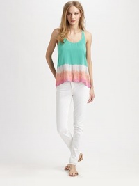 Airy racerback design with a vivacious tie-dyed print and cropped front hem. ScoopneckSleevelessCropped front hemRacerbackLonger length hits below the hips at backRayonHand washMade in USAModel shown is 5'10 (177cm) wearing US size Small. Airy racerback design with a vivacious tie-dyed print and cropped front hem. ScoopneckSleevelessCropped front hemRacerbackLonger length hits below the hips at backRayonHand washMade in USAModel shown is 5'10 (177cm) wearing US size Small.
