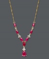 Brighten your look with elaborate design and bold hues. This intricate, y-shaped necklace highlights oval and pear-cut rubies (2-5/8 ct. t.w.) combined with the sparkle of round-cut diamonds (1/10 ct. t.w.). Set in 14k gold. Approximate length: 19 inches. Approximate drop: 1-1/2 inches.