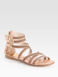 Backed by an exposed back zipper, this buttery leather gladiator has a chic tribal print and several adjustable buckles. Printed leather upperLeather lining and soleImported Backed by an exposed back zipper, this buttery leather gladiator has a chic tribal print and several adjustable buckles. Printed leather upperLeather lining and soleImported