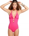 Take a plunge outside of the pool with GUESS?'s one-piece swimsuit. Cutouts and ruffles give it a unique look!