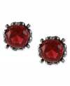 Red haute. This set of stud earrings from Betsey Johnson is crafted from hematite-tone mixed metal and features a red gem in the center for a stylish statement. Approximate drop: 1/2 inch.