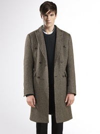 Basket weave, double-breasted overcoat with velvet detail under the collar.Front patch pocketsSingle back ventAbout 39.4 long84% wool/16% silkDry cleanMade in Italy Basket weave, double-breasted overcoat with velvet detail under the collar.Front patch pocketsSingle back ventAbout 39.4 long84% wool/16% silkDry cleanMade in Italy