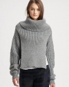 Cropped back adds a shawl effect to this wool-rich sweater with allover ribbing and a slouchy funnelneck. FunnelneckDropped shouldersLong sleevesCropped back hem60% wool/40% acrylicDry cleanImported of Italian fabricModel shown is 5'10 (177cm) wearing US size Small.