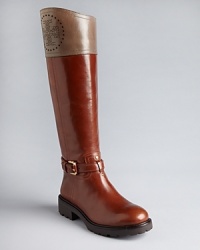 Perfed perfection: Tory Burch lightens up riding boots with perforated logo details and pale shades of leather. Sturdy lugged soles will take you places. Perfed perfection: Tory Burch lightens up riding boots with perforated logo details and pale shades of leather. Sturdy lugged soles will take you places.
