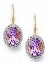 Sparkling perfection. Victoria Townsend's unique leverback earrings feature oval-cut amethyst (2-1/2 ct. t.w.) and sparkling diamond accents. Set in 18k gold over sterling silver. Approximate drop: 3/4 inch.