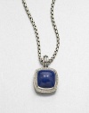 From the Albion Collection. A lapis cabochon set in sterling silver accented with brilliant diamonds on a bale. LapisDiamonds, .48 tcwSterling silverSize, about .66ImportedPlease note: Chain sold separately. 
