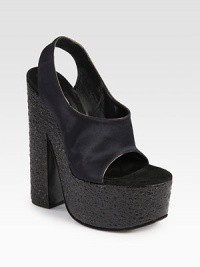 Glistening satin silhouette with a stretchy slingback strap, raised by a uniquely textured leather heel and platform. Textured leather heel, 6 (150mm)Textured leather platform, 2 (50mm)Compares to a 4 heel (100mm)Satin upperLeather lining and solePadded insoleMade in ItalyOUR FIT MODEL RECOMMENDS ordering one size up as this style runs small. Glistening satin silhouette with a stretchy slingback strap, raised by a uniquely textured leather heel and platform. Textured leather heel, 6 (150mm)Textured leather platform, 2 (50mm)Compares to a 4 heel (100mm)Satin upperLeather lining and solePadded insoleMade in ItalyOUR FIT MODEL RECOMMENDS ordering one size up as this style runs small.
