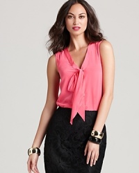 Luxurious silk lends undeniable elegance to this Lilly Pulitzer top, shockingly chic on its own or slipped under a crisp blazer. Luxurious silk lends undeniable elegance to this Lilly Pulitzer top, shockingly chic on its own or slipped under a crisp blazer.