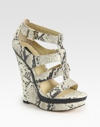 Snake-embossed leather wedge with wooden inserts and an adjustable ankle strap. Self-covered wedge, 5 (125mm)Covered platform, 1 (25mm)Compares to a 4 heel (100mm)Snake-embossed leather upperLeather lining and solePadded insoleImportedOUR FIT MODEL RECOMMENDS ordering true size. 