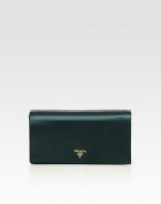 A classically elegant style of smooth satin in a boxy shape.Magnetic snap flap closureOne inside open pocketSatin lining9¾W X 5¼H X 1¾DMade in Italy