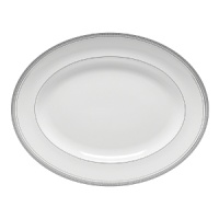 World-renowned fashion designer Monique Lhuillier collaborated with Waterford to create this fine bone china dinnerware collection. Drawing inspiration from the artful details that finish Lhuillier's brilliant couture bridal gowns, each piece in the assortment is decorated with polished platinum accents in a raised stitching design. World-renowned fashion designer Monique Lhuillier collaborated with Waterford to create this fine bone china dinnerware collection. Drawing inspiration from the artful details that finish Lhuillier's brilliant couture bridal gowns, each piece in the assortment is decorated with polished platinum accents in a raised stitching design.