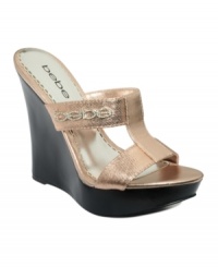 Beautiful sheen. Bebe's Freesia platform wedge sandals feature chunky straps with a large designer logo on the strap. Beautiful sheen. Bebe's Freesia platform wedge sandals feature chunky straps with a large designer logo on the strap.
