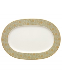 Perfect for casual dining or formal entertaining, this collection features a blend of gilded opulence and sophisticated style. Cheerful flower blossoms float gracefully across white bone china and gold and aqua filigree patterns as this lively set enhances your tabletop. Perfect for casual dining or formal entertaining, this collection features a blend of gilded opulence and sophisticated style. Cheerful flower blossoms float gracefully across white bone china and gold and aqua filigree patterns as this lively set enhances your tabletop.