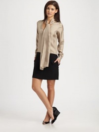 The quintessential combination of a feminine blouse and a classic skirt, a unique design with an elongated tie detail and convenient slash pockets.Self-tie detailButton cuffs on long sleevesButton closureSide zipperSlash pocketsSolid skirtBack yokeAbout 15 from natural waistSilkDry cleanMade in USA of imported fabric Model shown is 5'9½ (176cm) wearing US size Small. The quintessential combination of a feminine blouse and a classic skirt, a unique design with an elongated tie detail and convenient slash pockets.Self-tie detailButton cuffs on long sleevesButton closureSide zipperSlash pocketsSolid skirtBack yokeAbout 15 from natural waistSilkDry cleanMade in USA of imported fabric Model shown is 5'9½ (176cm) wearing US size Small.