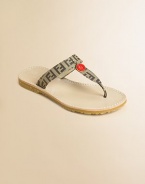 Accented by designer logos, these chic t-strap sandals are on every girl's most-wanted list.Slip-onCanvas upperRubber soleLogo pendantImportedAdditional InformationKid's Shoe Size Guide (European Equivalent) 