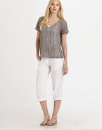 This airy knit with a hint of shimmer, thanks to metallic thread, also features a feminine neckline and beloved fit.V-neckShort sleevesPull-on styleAbout 24 from shoulder to hem83% linen/16% metallic thread/1% cottonHand washImported of Italian fabric Model shown is 5'10 (177cm) wearing US size Small. 