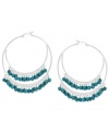 A stunning statement, twice over. These double hoop earrings are set in sterling silver and dazzle with beautiful turquoise (3/8 ct. t.w.) beads. Approximate diameter: 2 inches.