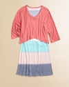 It looks like a tee with a skirt but this easy, pretty style is actually one piece with a loose solid bodice attached to a slightly flared, widely striped skirt.V necklineThree-quarter sleevesTop has loose, contour hemSlight A-line shapePullover styling50% rayon/50% polyesterMachine washImported