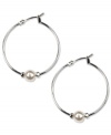 Perfectly polished. These Anne Klein classic hoop earrings feature added elegance with white plastic pearls and glass stone accents. Crafted in imitation rhodium-plated mixed metal. Approximate diameter: 1-1/4 inches.