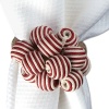 Brightly striped beads and baubles give this Juliska napkin ring a whimsical, homespun look.