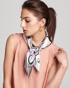 Subtle shades of pink and lilac accent the signature swirls of this Emilio Pucci scarf, a transitional piece for day to night.