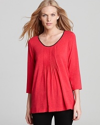 Over leggings or lounge pants, DKNY's three-quarter sleeve T-shirt is the epitome of at-home comfort. Over leggings or lounge pants, DKNY's three-quarter sleeve T-shirt is the epitome of at-home comfort.