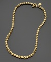 Get style you can rely on by Lauren by Ralph Lauren. This necklace features graduated beads crafted in goldtone mixed metal. Approximate length: 16 inches.