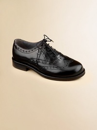Constructed in the softest leather, this classic oxford is designed in a lace-up silhouette with intricate cut-out details.Lace-upLeather upperLeather liningRubber solePadded insoleImported Constructed in the softest leather, this classic oxford is designed in a lace-up silhouette with intricate cut-out details.Lace-upLeather upperLeather liningRubber solePadded insoleImported