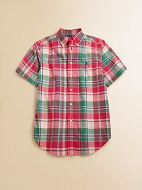 A tried-and-true button-front design is rendered in a vibrant madras plaid.Button-down collarShort sleevesButton frontBox-pleated backShirttail hemCottonMachine washImported Please note: Number of buttons may vary depending on size ordered. A tried-and-true button-front design is rendered in a vibrant madras plaid.Button-down collarShort sleevesButton frontBox-pleated backShirttail hemCottonMachine washImported Please note: Number of buttons may vary depending on size ordered.