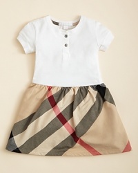 A check printed ruffle at the hem adds a playful touch to a classic Burberry dress, crafted in the softest cotton jersey. A check printed ruffle at the hem adds a playful touch to a classic Burberry dress, crafted in the softest cotton jersey.