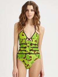 From its floral print and classic halter strap ties to its edgy cutout center and corset-inspired, waist-accentuating bodice, this design is simply irresistible.Halter strap ties at neckIntriguing cutout center detailTrim details create sexy corset effectBack clasp closure80% nylon/20% elastaneHand washMade in USA From its floral print and classic halter strap ties to its edgy cutout center and corset-inspired, waist-accentuating bodice, this design is simply irresistible.Halter strap ties at neckIntriguing cutout center detailTrim details create sexy corset effectBack clasp closure80% nylon/20% elastaneHand washMade in USA