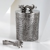 The grand form of a mythical dragon was the muse behind this sculptural hand-case ice bucket set from Natori.