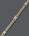 Two tone color for ultimate versatility. Crafted from 14k gold over sterling silver and sterling silver, this double row rope bracelet receives an extra-stylish touch with the addition of X-shaped accents. Approximate length: 7-1/2 inches.