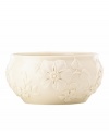 Teeming with fresh blooms in graceful ivory porcelain, the Floral Fields bowl from Lenox has a serene, understated elegance. A simple silhouette balances elaborate sculpted detail.