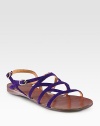 Strappy suede essential with a rubber sole and an adjustable ankle strap. Suede upperLeather liningRubber solePadded insoleMade in SpainOUR FIT MODEL RECOMMENDS ordering one half size up as this style runs small. 