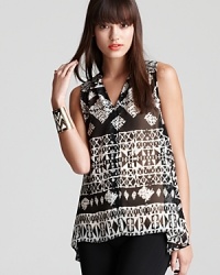 In a sheer texture, this sleeveless Aqua blouse boasts a smart tribal print for a trend-right take on a classic style. Team with streamlined skinnies and put a new spin on a go-to staple. In a sheer texture, this sleeveless Aqua blouse boasts a smart tribal print for a trend-right take on a classic style. Team with streamlined skinnies and put a new spin on a go-to staple.