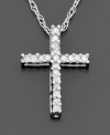 Across her heart… a special cross pendant sparkling bright with round-cut diamonds ( 1/10 ct. t.w.) set in 14k white gold. Diamond necklace chain measures 18 inches; pendant measures 3/4 inches.