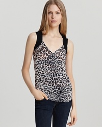 A ruched Sweet Pea boasts fierce animal print and draping through the front for eye-catching style--day or night. Pair with pencil pants and a teetering heel for the perfect finish. A ruched Sweet Pea boasts fierce animal print and draping through the front for eye-catching style--day or night. Pair with pencil pants and a teetering heel for the perfect finish.