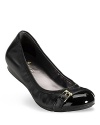 Buckled down elegance in a ballet flat with cap toe detail. From Cole Haan.